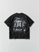 Monaco Social Club Toronto hockey tee in faded black, back flat lay showing blurred blue and white hockey artwork, Toronto script and a maple leaf.