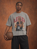 Monaco Social Club Basketball Club: model in a washed grey oversized boxy raw hem tee with a vintage basketball player photo front graphic, holding a leather basketball