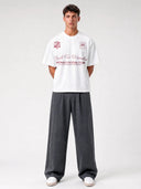 Arctic white Varsity 35 oversized paneled shirt worn by model with burgundy crest and front graphics.