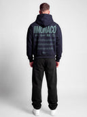 Navy Monaco Aesthetic athleisure hoodie on model, back view with green Monaco logo stack and lifestyle typography.