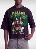 Black Dallas Stars Taz boxy tee on model, front view with green and gold arched team lettering.