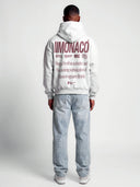 Monaco Aesthetic heather gray hoodie worn by model, back view with burgundy Monaco logo and lifestyle typography.