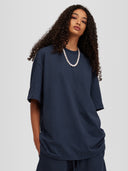 Model wearing midnight navy Monaco Social Club oversized tee with relaxed fit