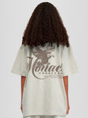Model wearing heather gray Monaco Social Club oversized tee with faded eagle back graphic