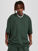 Model wearing cactus green Monaco Social Club oversized tee with dropped shoulders