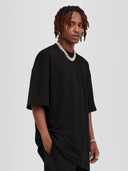 Model wearing black Monaco Social Club oversized tee with dropped shoulders