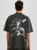 Man model wearing the Celebrini Legacy Blur Heavyweight Raw Hem Tee with motion blur hockey graphic — Monaco Social Club streetwear