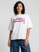 Arctic white Monaco Sponsor raw hem tee on model, front view with red Monaco logo and No. 35 chest graphic.