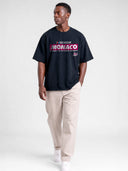 Navy blue Monaco Sponsor oversized racing tee on model, front view with Monaco logo and No. 35 graphic.