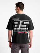 Monaco Sponsor faded black heavyweight tee worn by model, back view with large No. 35 and racing sponsor graphics.