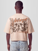 Man model wearing the Fearless Heavyweight Boxy Tee with skull-butterfly roses graphic and Monaco script — Monaco Social Club streetwear