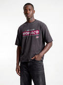 Monaco Sponsor dark grey heavyweight tee on model, front view featuring the red Monaco racing logo and No. 35.