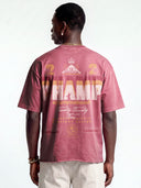 Faded merlot Monaco Champ oversized tee worn by model, back view with large cream and gold typographic artwork.
