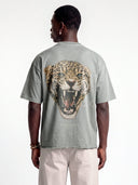 Light grey Untamed oversized tee worn by model, back view with a large leopard graphic and Monaco text.