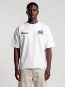 Arctic white Open Land oversized tee worn by model, front view with Monaco and three-horse chest prints.