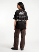 Faded black Open Land Tee, back mockup with white three-horse artwork, Country Heritage and Monaco text.