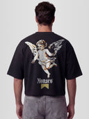 Man model wearing The Cherub Heavyweight Boxy Tee in Black with single angel and Monaco gold ribbon graphic — Monaco Social Club streetwear
