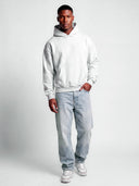 Heather grey Monaco athleisure tapered hoodie worn by model, front view showing plain design and kangaroo pocket.