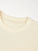 Ribbed crewneck collar detail on the ivory Monaco heavyweight cotton boxy tee.