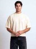 Monaco ivory boxy tee worn by model, front view showing boxy fit and plain chest.