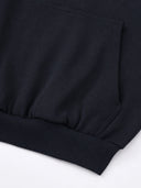 Black Monaco athleisure hoodie detail showing kangaroo pocket stitching and ribbed waistband.