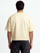 Monaco ivory boxy tee worn by model, back view showing heavyweight 280 GSM cotton and wide sleeves.