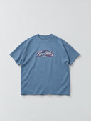 Monaco Social Club New-York Blur Tee in slate blue, front flat lay showing a New York skyline and Hockey Club chest graphic.