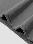 Monaco raw hem T-shirt close-up showing heavyweight cotton fabric and unfinished hem edge.