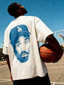 Drop shoulder white tee with blue basketball player print on the t-shirt back.