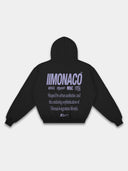 Monaco Aesthetic black hoodie back mockup with lavender logo stack, statement typography and hood.