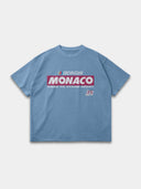 Slate blue Monaco Sponsor raw hem tee, front mockup with red-and-white Monaco logo and No. 35 graphic.