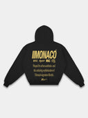 Black Monaco Aesthetic athleisure hoodie back mockup with gold stacked branding and lifestyle typography.