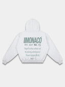 Heather gray graphic hoodie back mockup by Monaco with green stacked logos, lifestyle typography and ribbed trim.