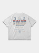The Champ Tee in arctic white, back mockup with cream, red and blue typography and Monaco crest graphics.