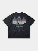 The Champ Tee in navy blue, back mockup showing oversized red, blue and cream typography with Monaco crest.