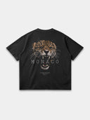 Faded black Untamed Tee, back mockup with a large brown snarling leopard graphic and Monaco wordmark.