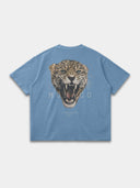 Untamed Tee in slate blue, back mockup featuring a large snarling leopard and Monaco wordmark.