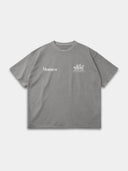 Light grey Open Land raw hem tee, front mockup with white Monaco wordmark and three-horse chest graphic.