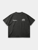 The Open Land Tee in faded black, front mockup with contrasting Monaco and three-horse chest graphics.