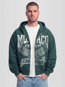 Man Wearing The Authentic Club Heavyweight Full-Zip Hoodie in Pine Green — Monaco Social Club streetwear