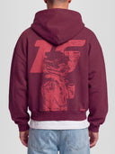 Model wearing the Racer No. 16 Heavyweight Full-Zip Hoodie in Burgundy with tonal racing driver graphic — Monaco Social Club streetwear
