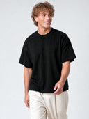 Black Monaco paneled shirt worn by model, front view with oversized fit and structured shoulder seams.