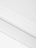 White Monaco 100% cotton paneled shirt close-up showing fabric texture and interior seam stitching.